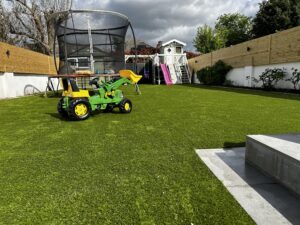 Tallagh large garden with artificial grass and cladding fencing